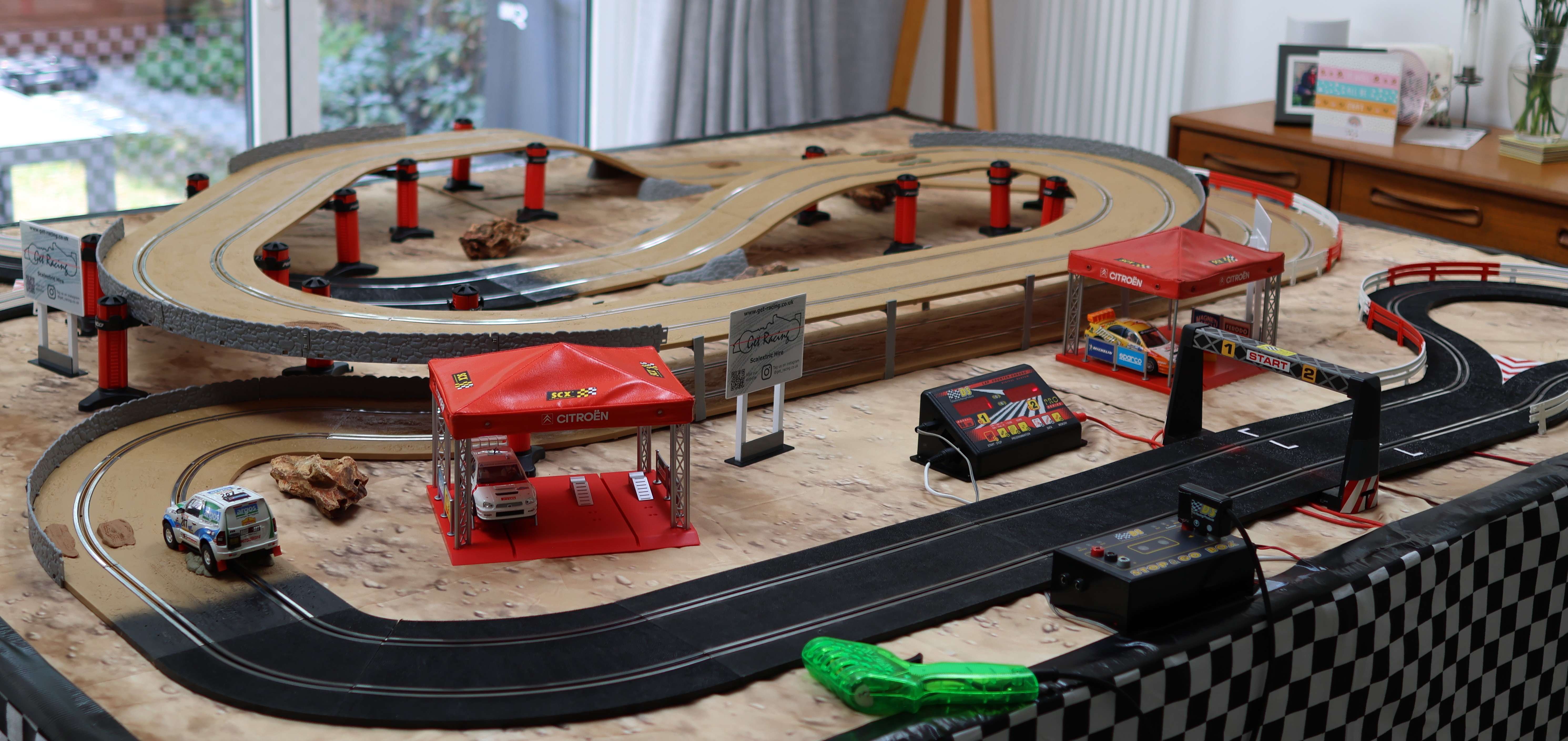Full off-road Scalextric layout showing the desert scenery, pit gazebo and start line